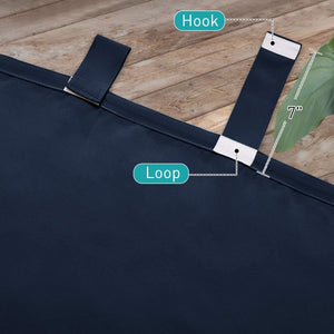 Close-up of navy blue curtain fabric showing the hook and loop tab top fasteners, measured at 7 inches.