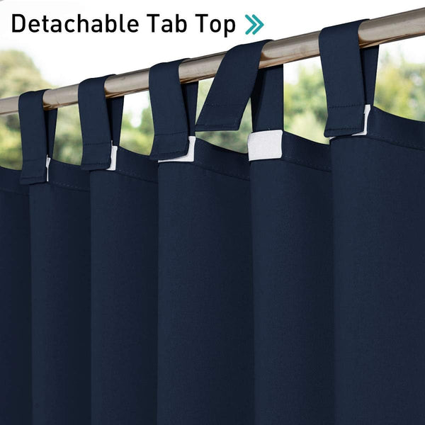Navy blue curtains with detachable tab top loops secured by white fasteners on a gold curtain rod.