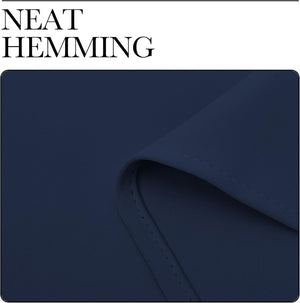 Close-up of navy blue fabric with visible, consistent hemming stitch detail along a folded edge.