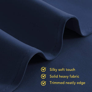 Close-up of dark navy blue heavy fabric with a silky soft touch and neatly trimmed edge.