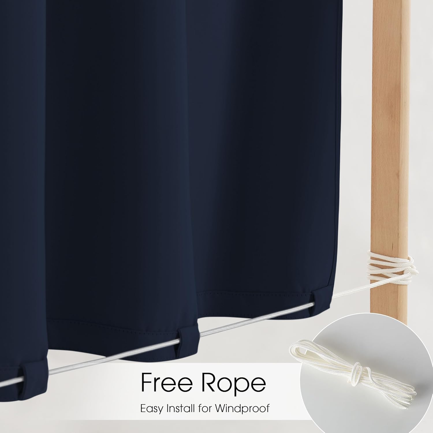 Navy blue outdoor curtains with a white windproof rope at the bottom, secured to a wooden post.