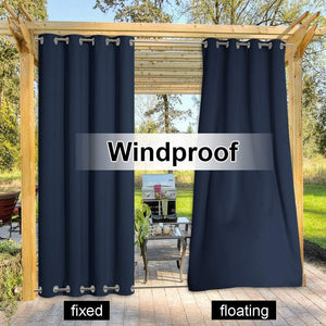 Navy blue windproof outdoor curtains with silver grommets on a wooden pergola for patio.