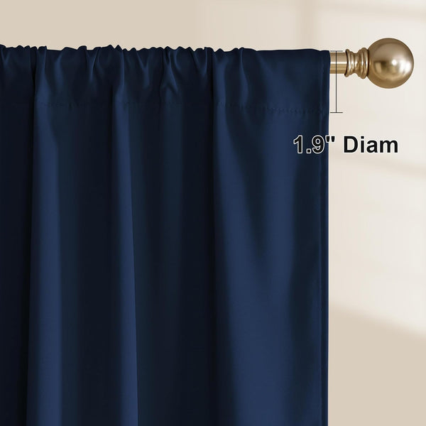 Navy blue curtain panel with rod pocket header, hanging on a brass rod. 1.9 inch diameter shown.