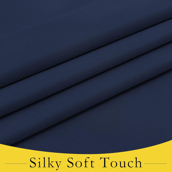 Close-up of navy blue fabric with visible soft, silky texture and elegant folds