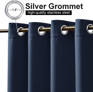 Close-up of navy blue curtains with 1.6-inch silver stainless steel grommets, hanging from a gold rod.