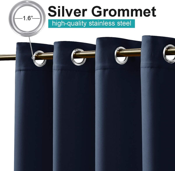 Navy blue curtains with visible silver 1.6 inch stainless steel grommet tops on a gold rod.
