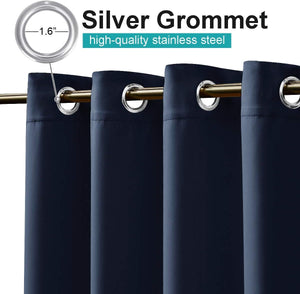 Navy blue curtains with visible silver 1.6 inch stainless steel grommet tops on a gold rod.