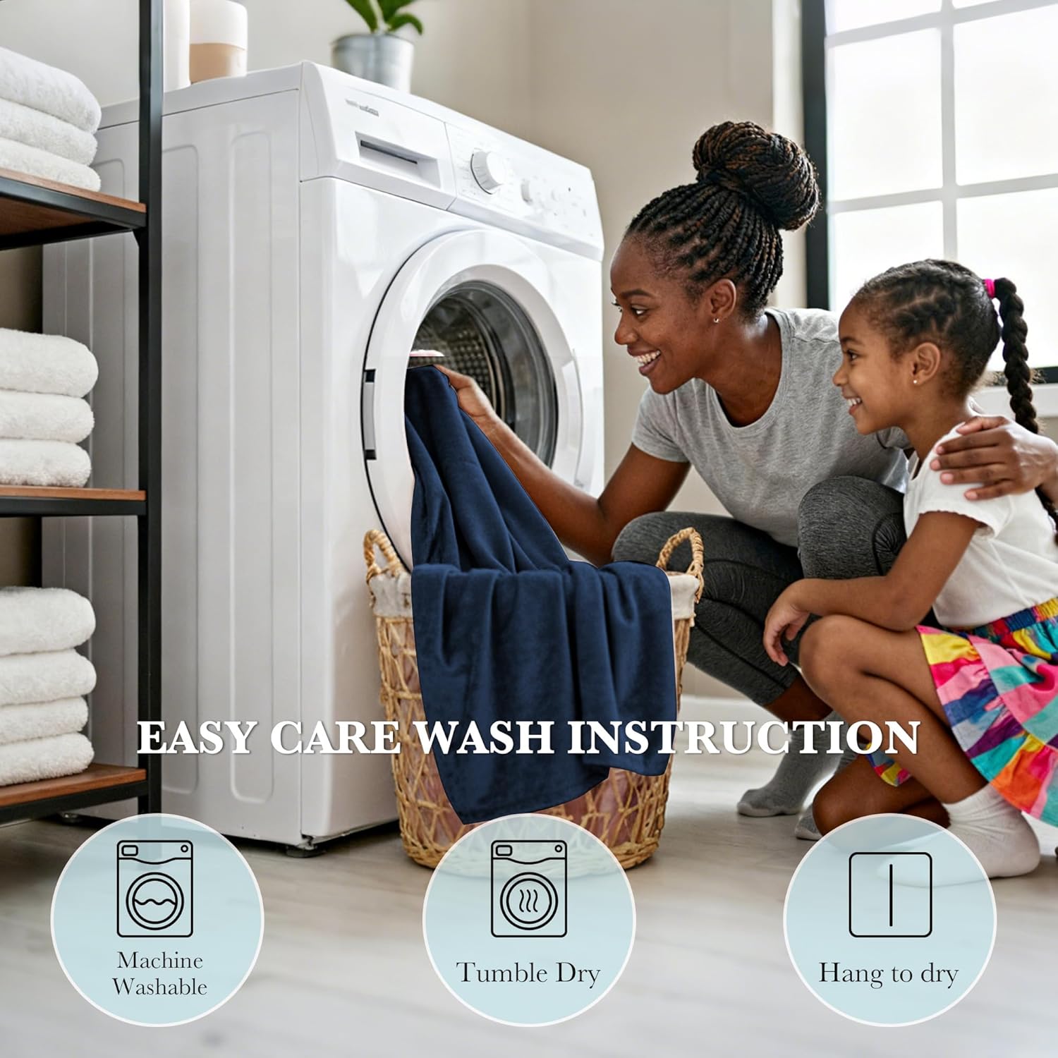 Smiling woman and child loading a navy blue plush blanket into a washing machine for easy care.