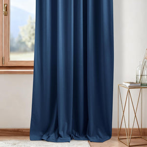 Elegant navy blue velvet blackout curtain panel drapes fully over a wooden window frame.