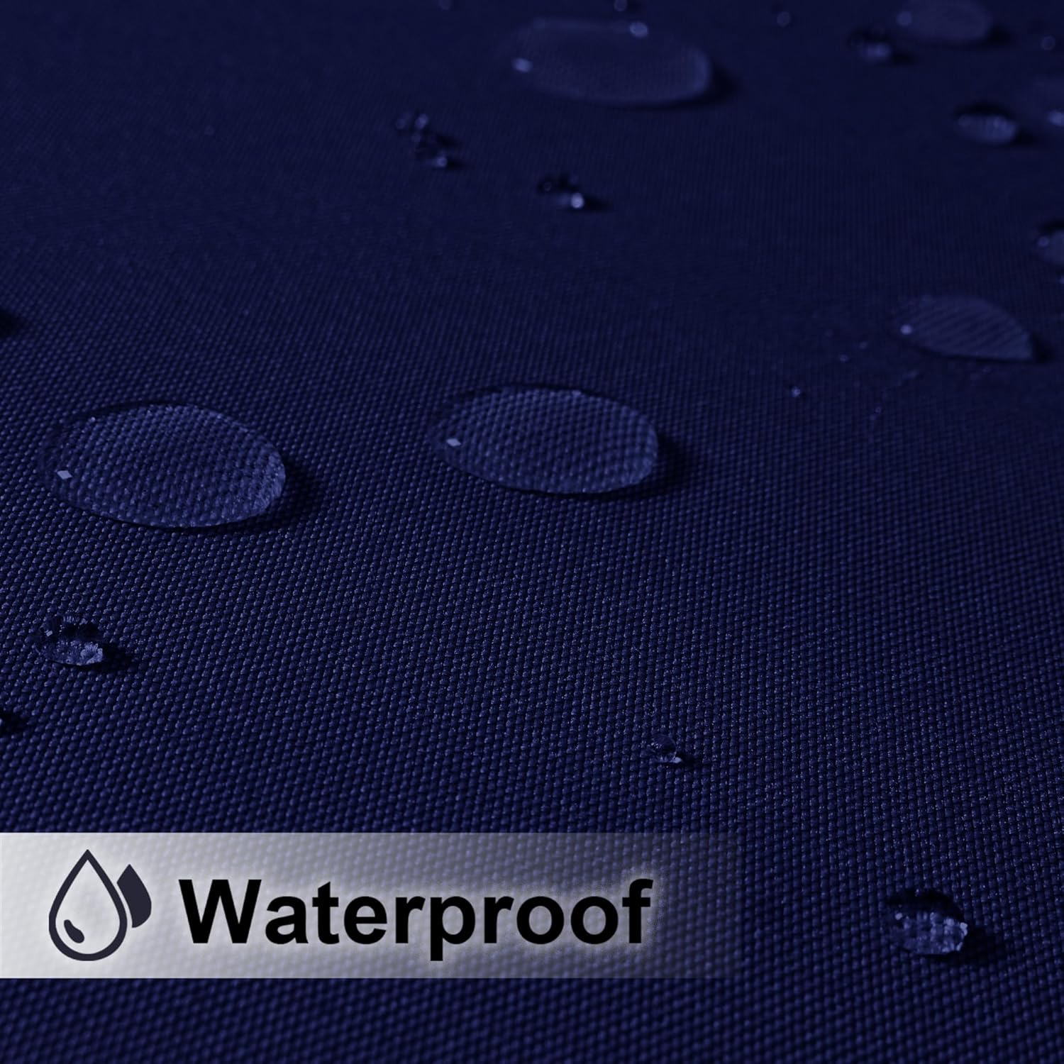 Navy blue woven fabric with water droplets beading on surface, demonstrating waterproof quality.