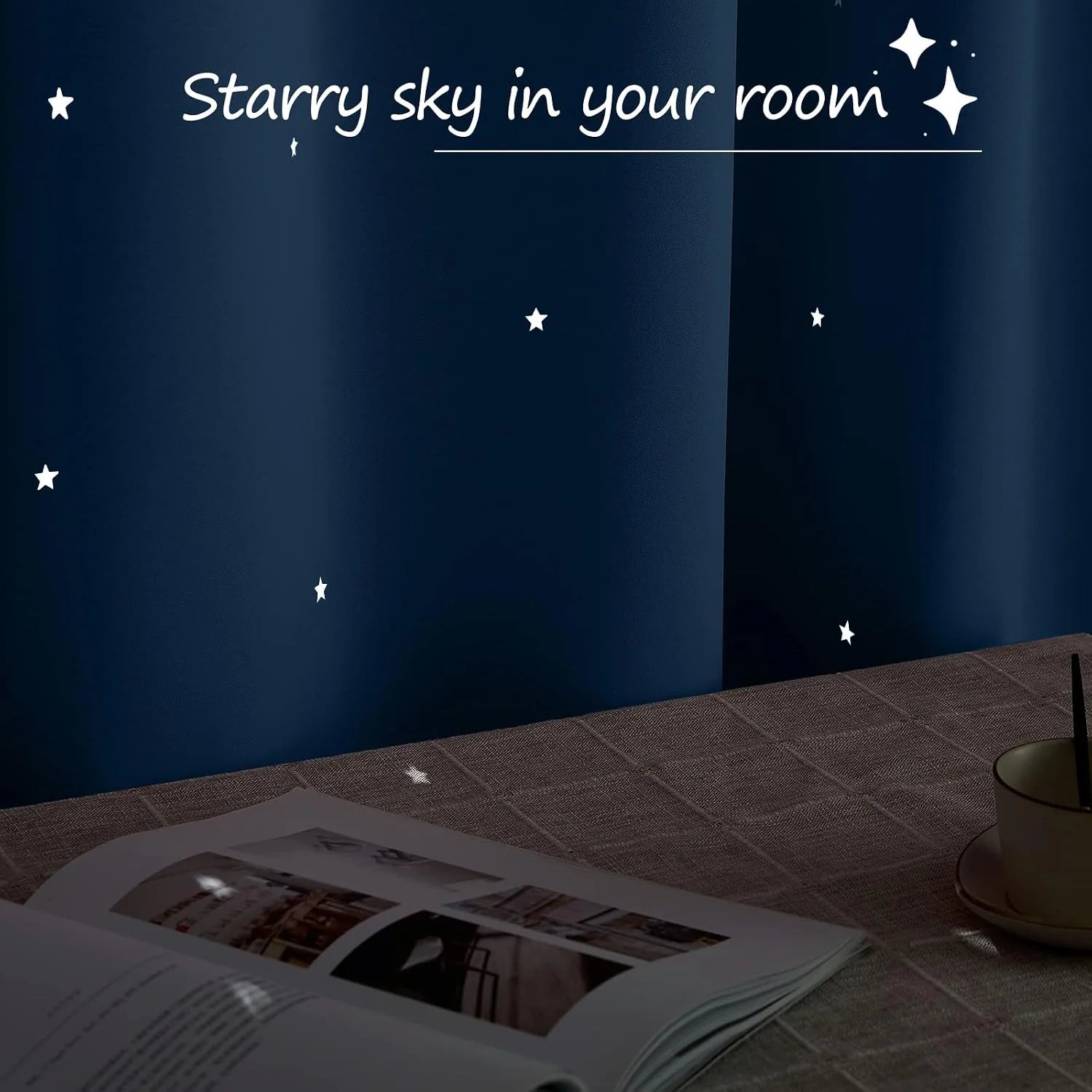 Glow-in-the-dark white star decals on a navy wall above a desk with book and cup