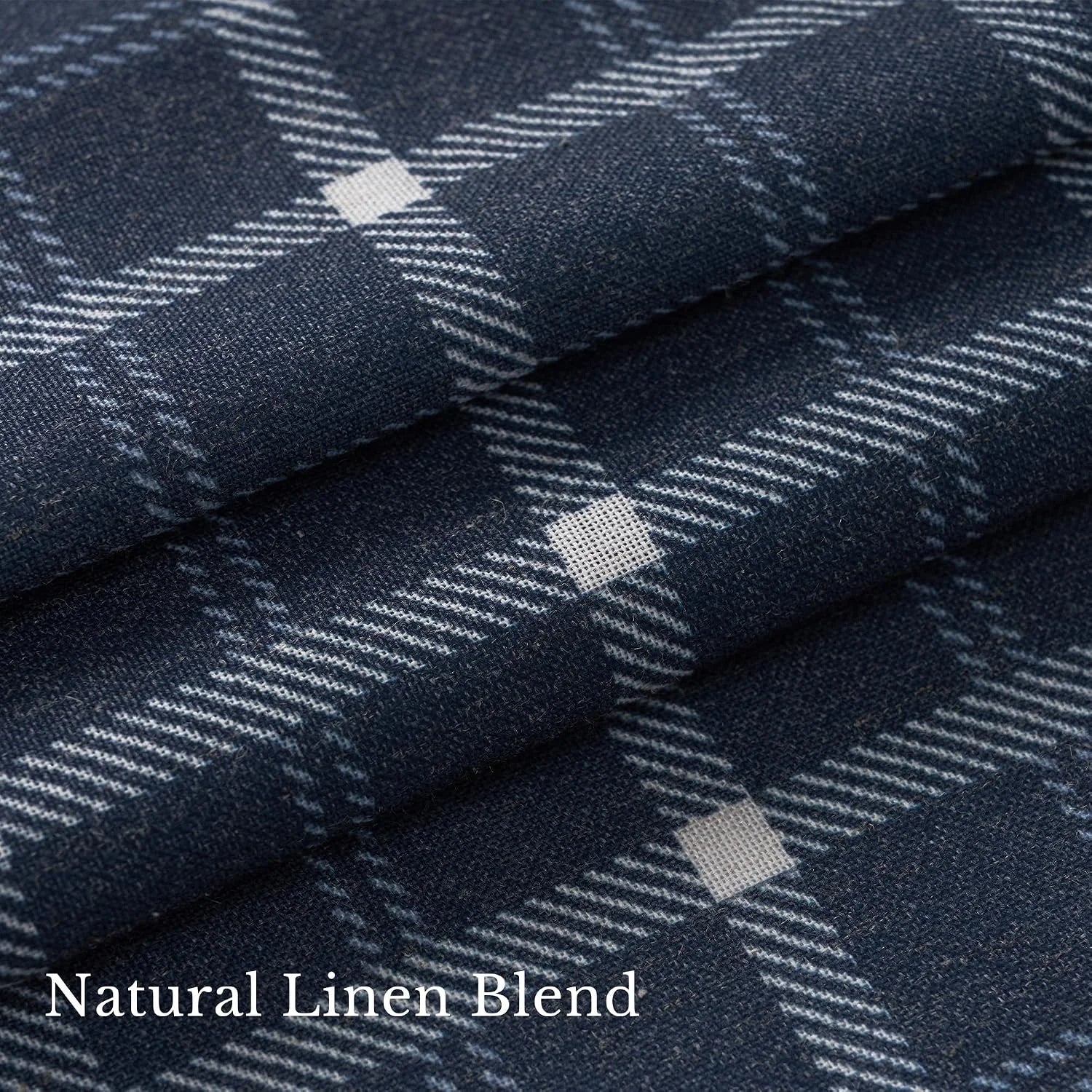 Close-up of navy linen blend fabric with white plaid pattern and soft woven texture