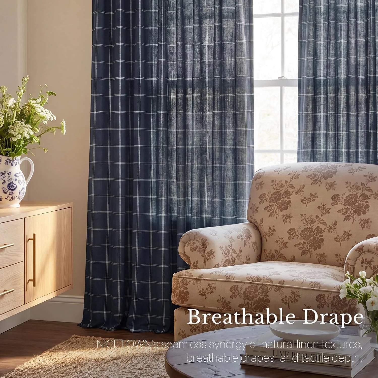 Navy linen-look windowpane curtains in a cozy living room with floral armchair