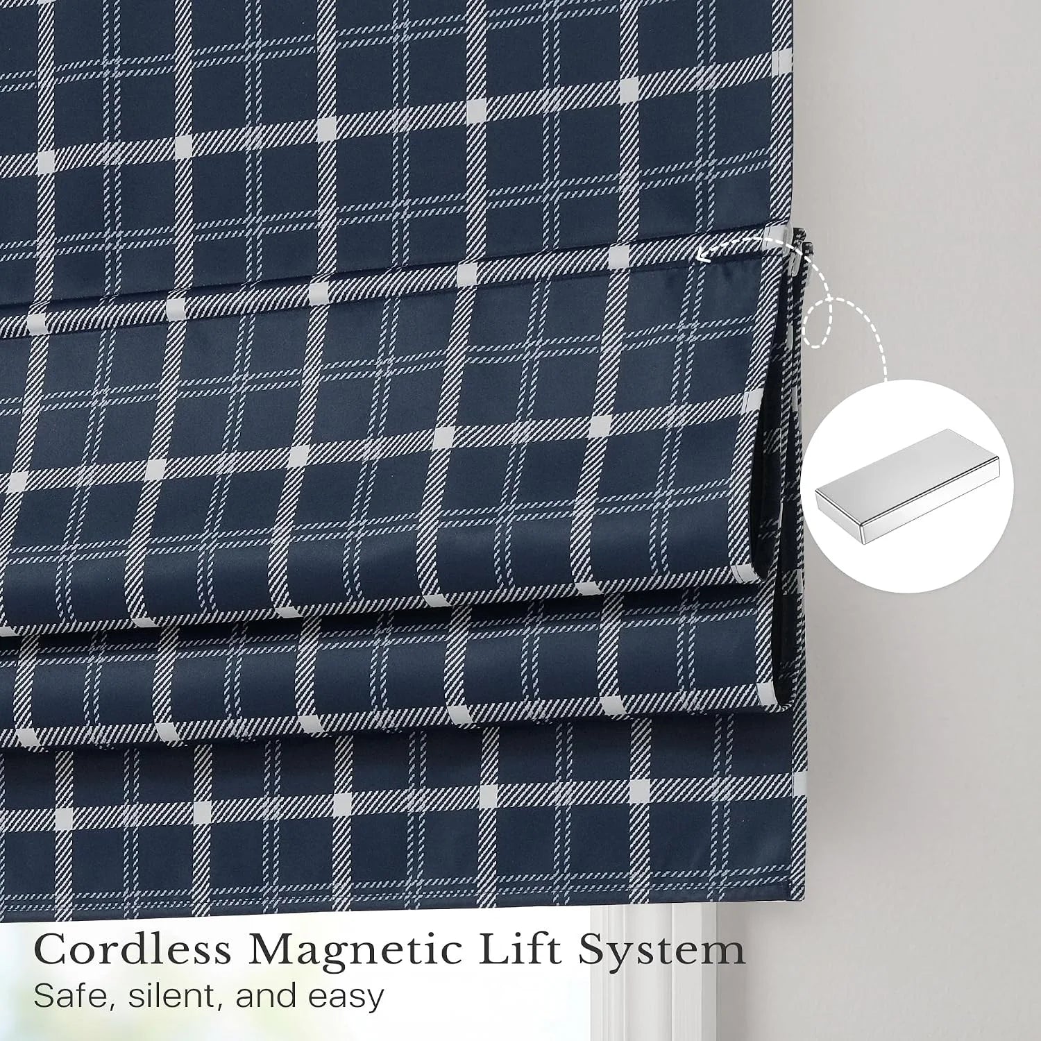 Navy plaid cordless Roman shade with magnetic lift folds on a white window