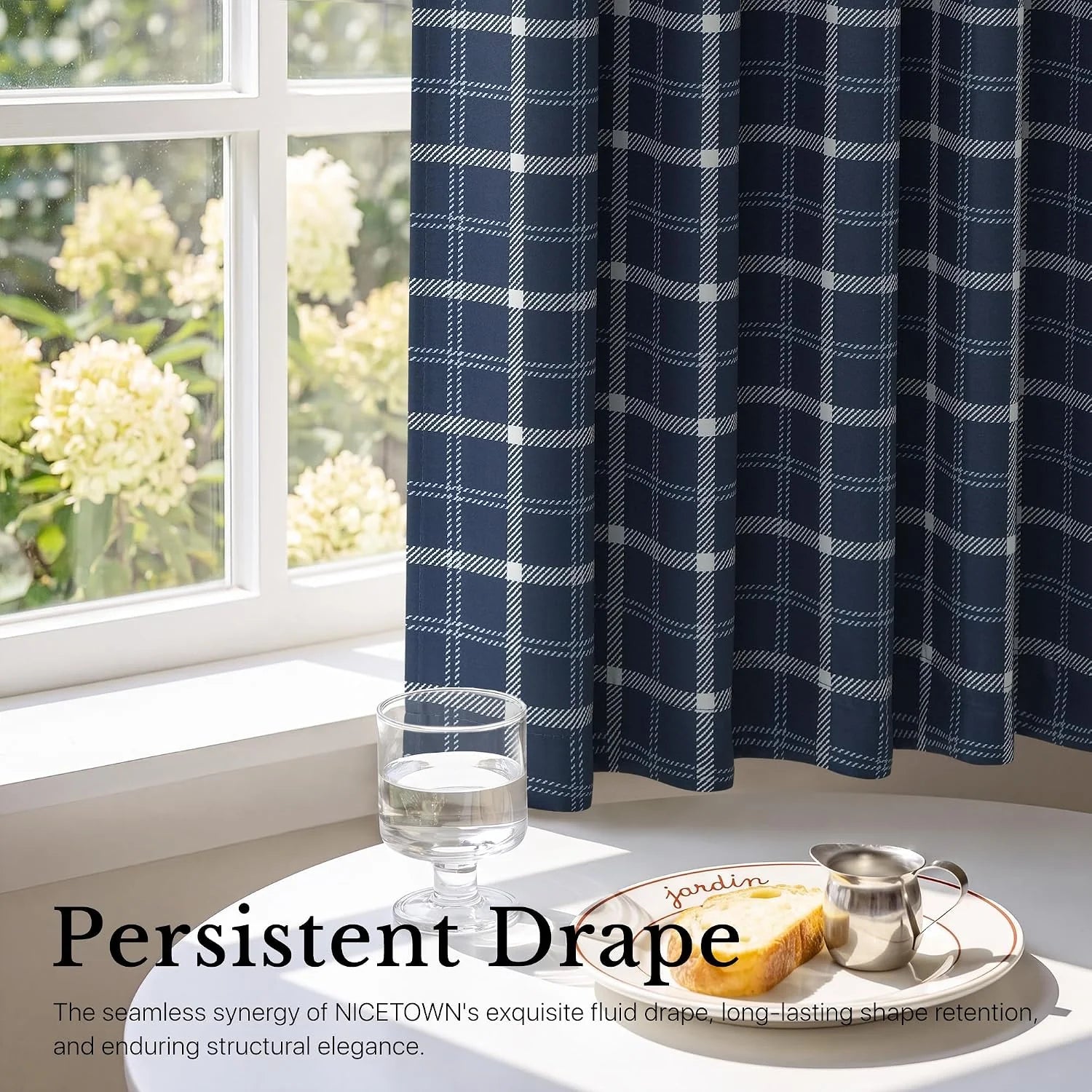 Navy plaid tier curtains by a bright window above a breakfast table