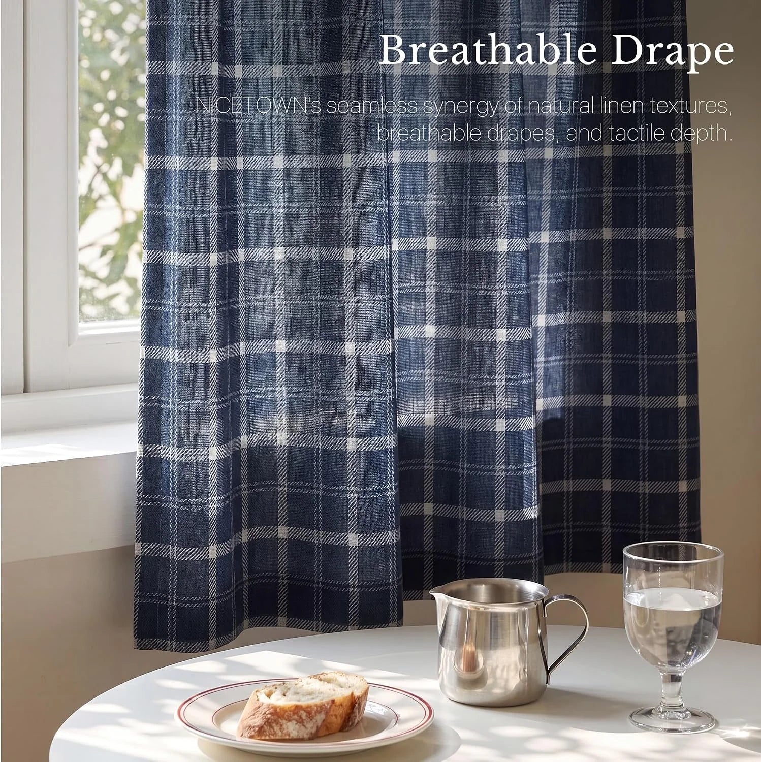 Navy plaid linen cafe curtain hanging by a sunlit window above a breakfast table