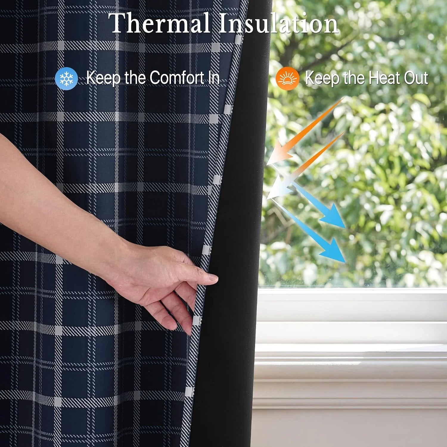 Hand pulling back navy plaid thermal blackout curtain to show black insulated lining