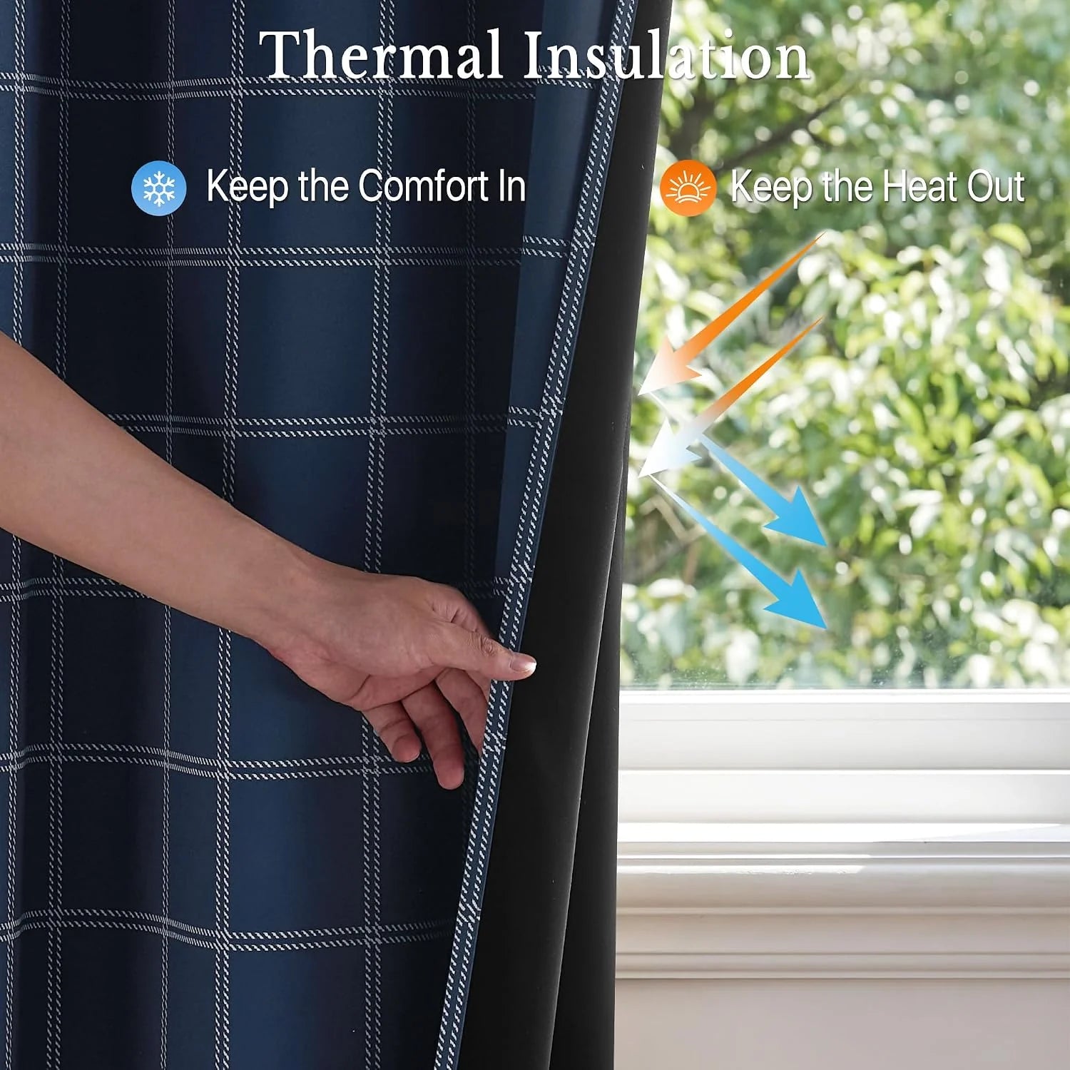 Hand pulling back navy plaid thermal blackout curtain beside a bright window