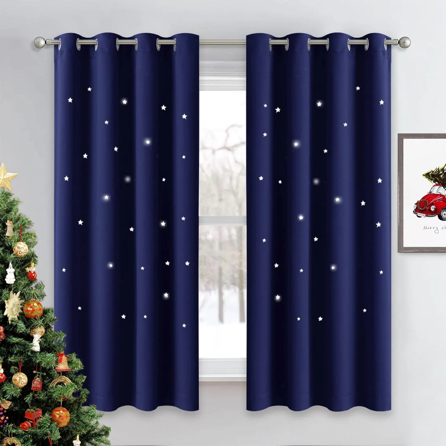 Navy blackout curtains with glowing star pattern and silver grommets on a window