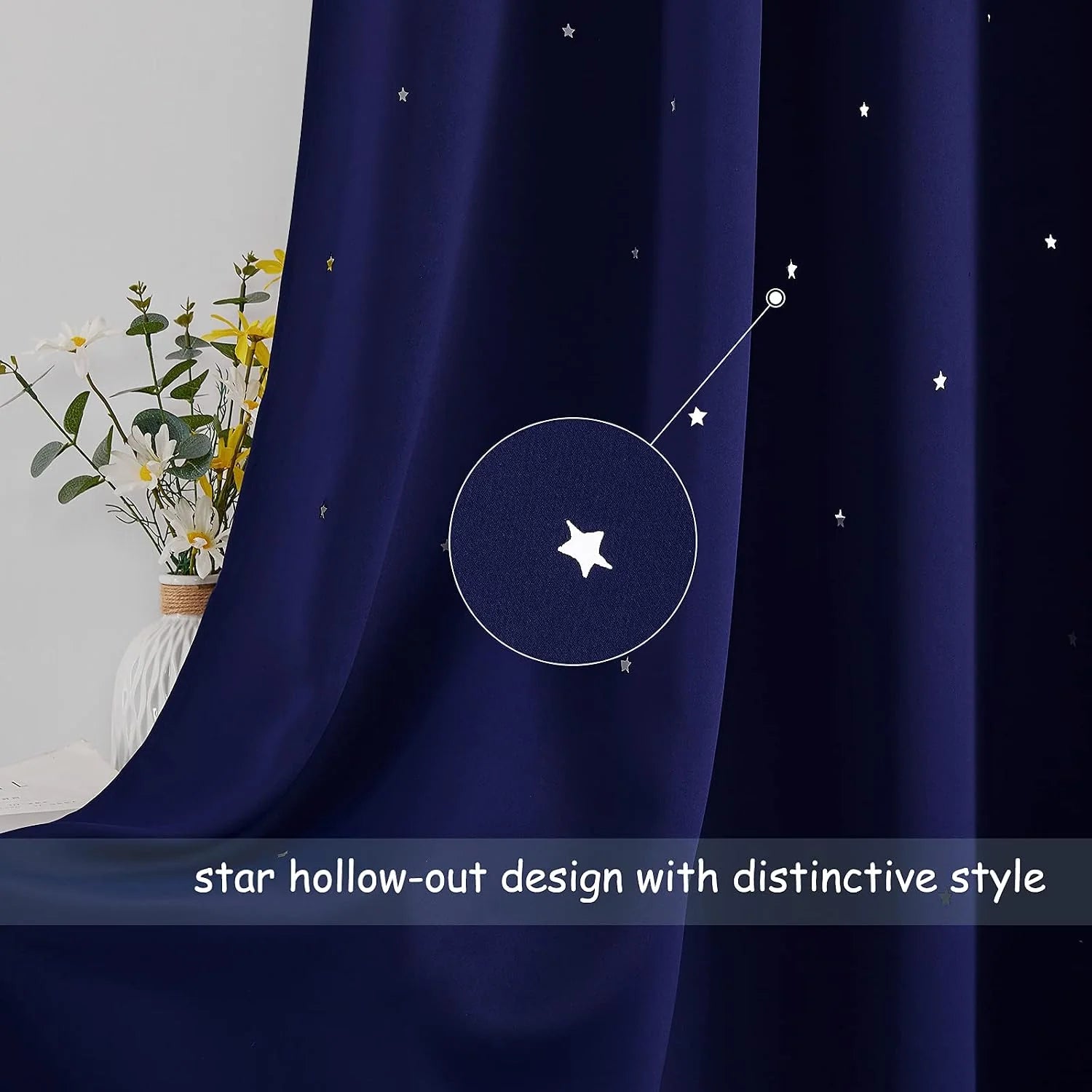 Navy curtain with white star cutout pattern shown in a styled room close-up