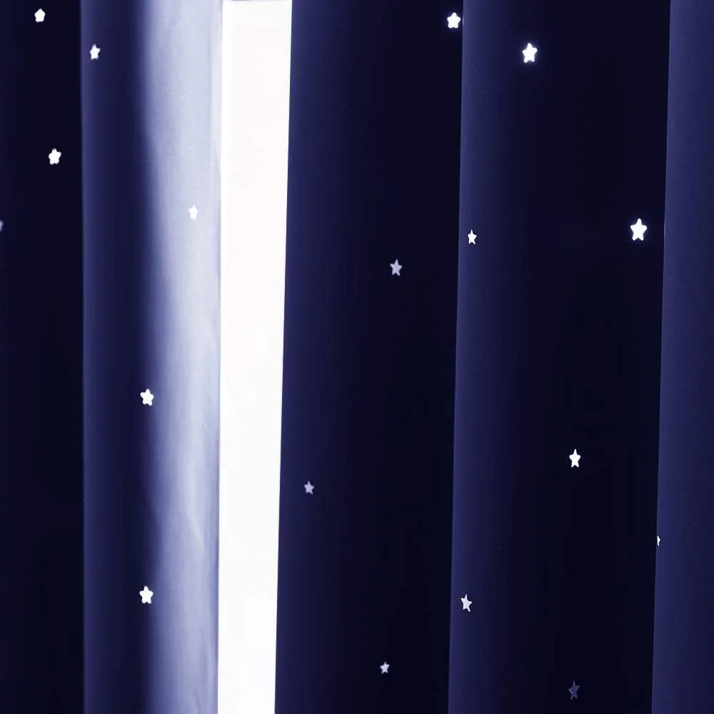 Navy blackout curtain panel with scattered white star pattern and soft pleats