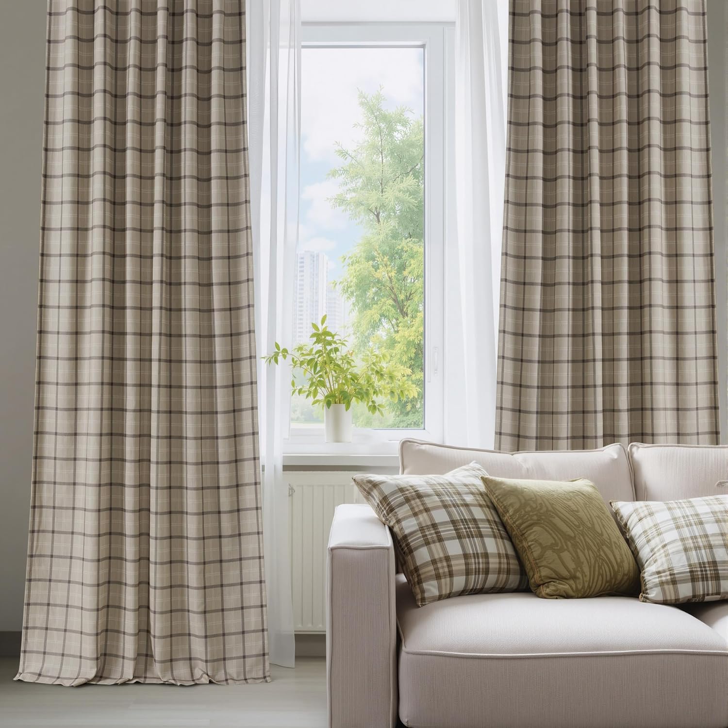 Beige and brown plaid curtains in a living room. Cream sofa with matching cushions.
