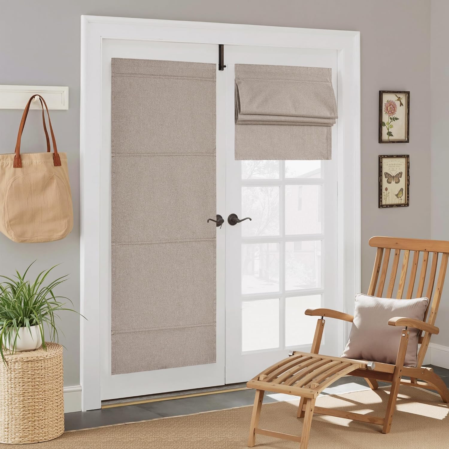 Textured neutral fabric roman shades on white French doors, one extended and the other folded up.