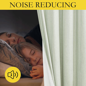Light green noise reducing curtains creating a dark, peaceful bedroom for a sleeping mother and child.