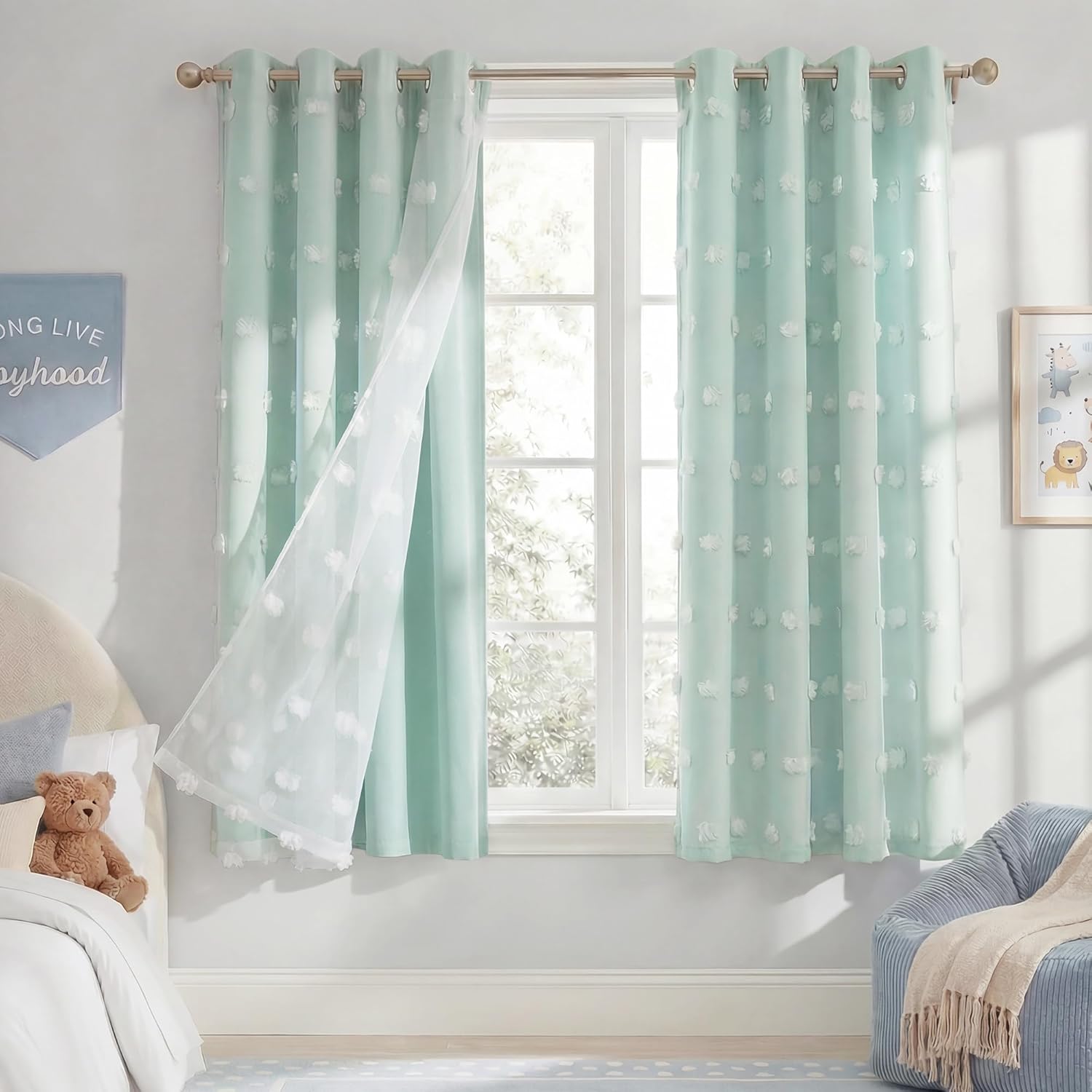 Light mint green grommet blackout curtains with white tufted dots and sheer overlay.