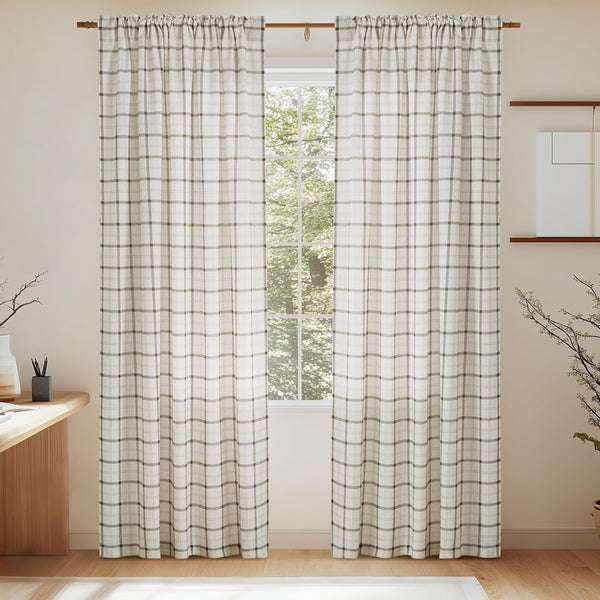Pair of off-white and brown plaid rod pocket curtains on a wooden rod.