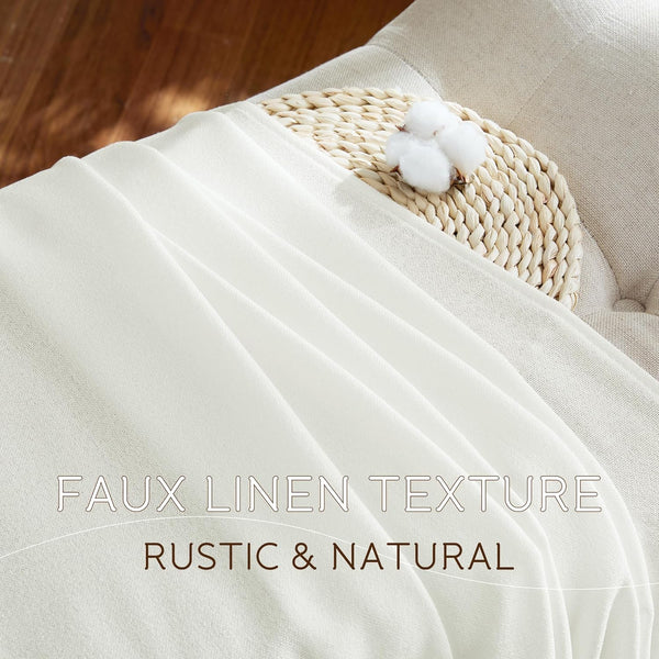 Detailed view of off-white faux linen textured sheer curtain with elegant folds, styled with cotton bolls.