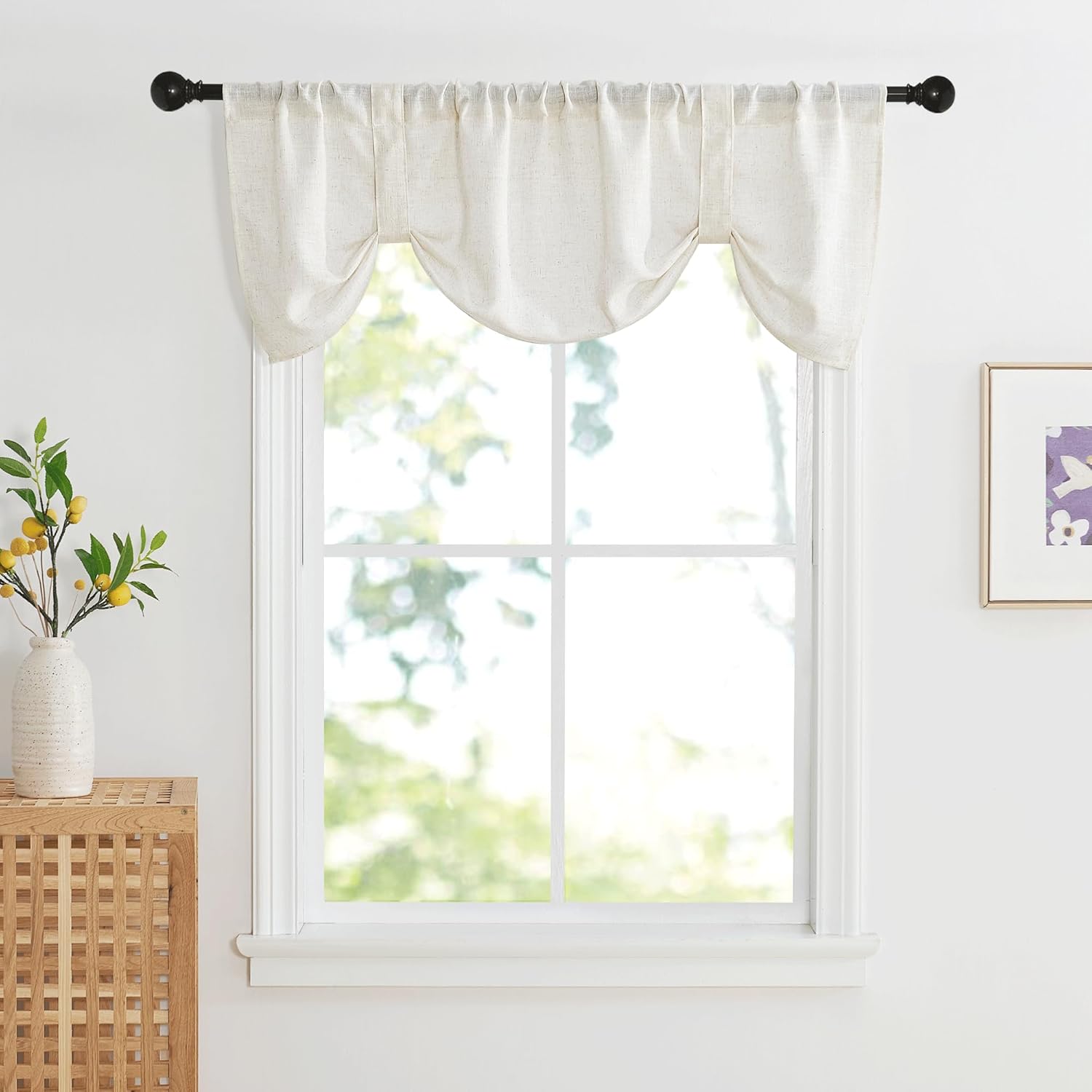 Off-white textured linen valance with a gathered, arched balloon design, hung on a black rod.