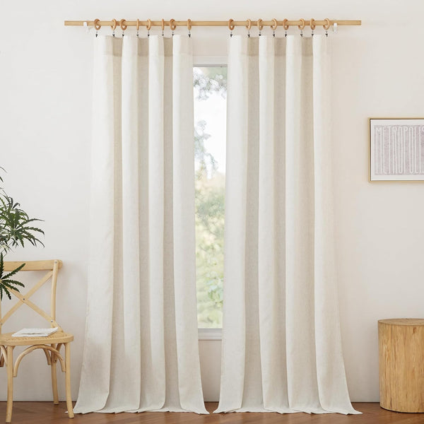 Pair of off-white textured linen curtains with wooden clip rings on a natural rod.