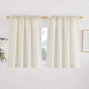 Pair of off-white natural linen cafe curtains with visible texture, hung on a wooden rod with a gathered rod pocket top.