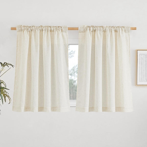 Pair of off-white natural linen cafe curtains with visible texture, hung on a wooden rod with a gathered rod pocket top.