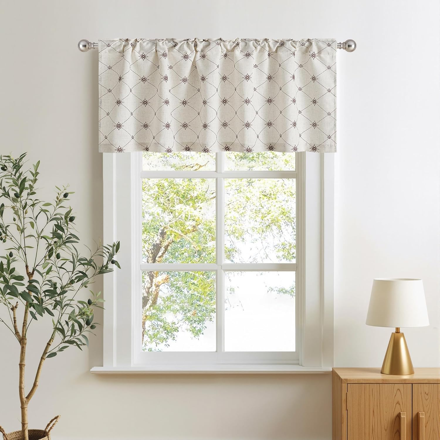 Off-white valance featuring a brown geometric diamond and star pattern, with a gathered rod pocket top.