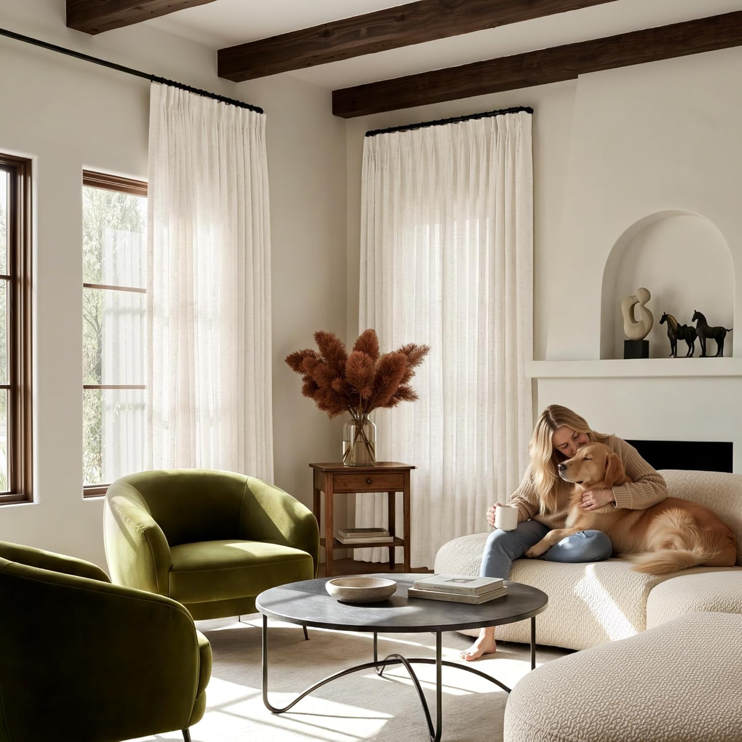 Off-white pleated sheer curtains with black trim, mounted on a ceiling rod in a bright living room.