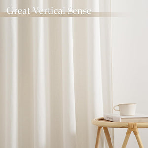 Off-white textured curtain, exhibiting strong vertical folds and an elegant, minimalist drape.