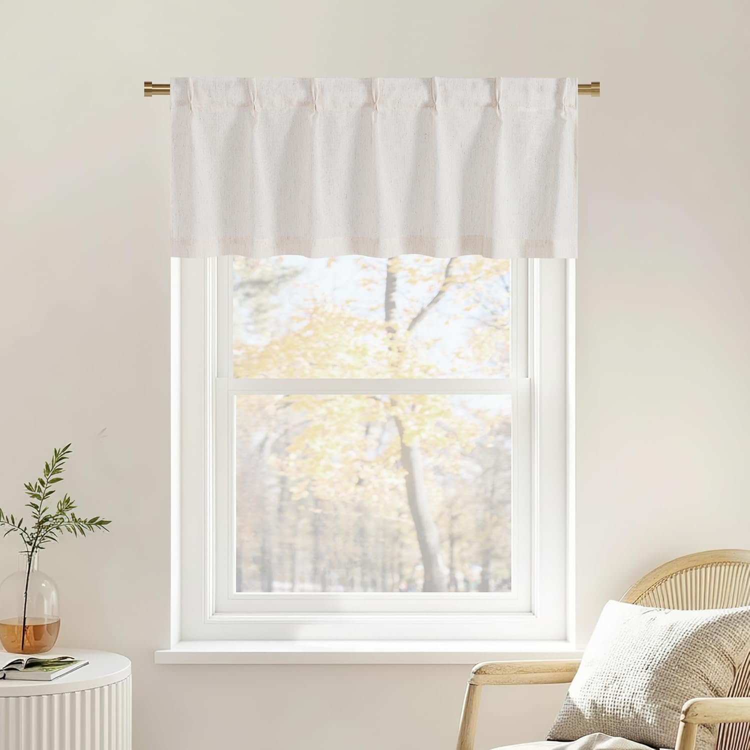 Off-white textured linen blend valance with a rod pocket top, hung on a brass rod over a sunlit window.