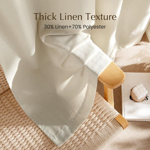 Close-up of an off-white thick linen blend curtain fabric with subtle texture, draped over a wooden chair.