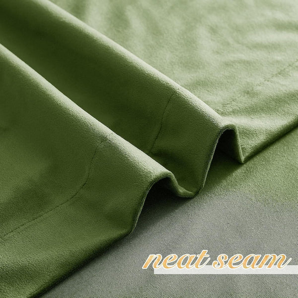 Close-up of olive green fabric showcasing a soft texture and a meticulously neat seam.