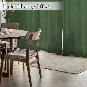 Olive green light filtering curtains provide privacy while allowing soft natural light into a modern dining room.