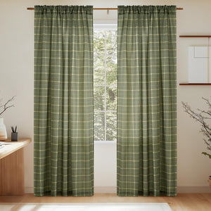 Olive green plaid curtains with woven texture and gathered rod pocket top, hanging over a window.