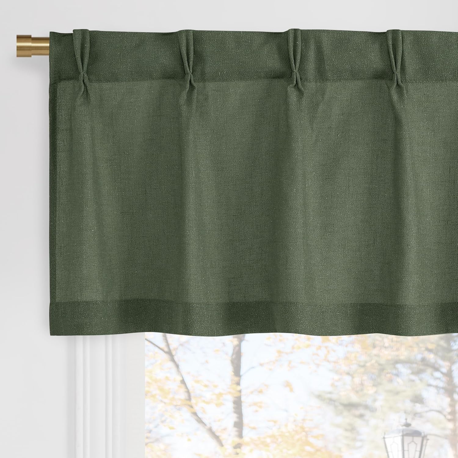 Olive green textured valance with decorative tied top, hanging on a gold curtain rod.