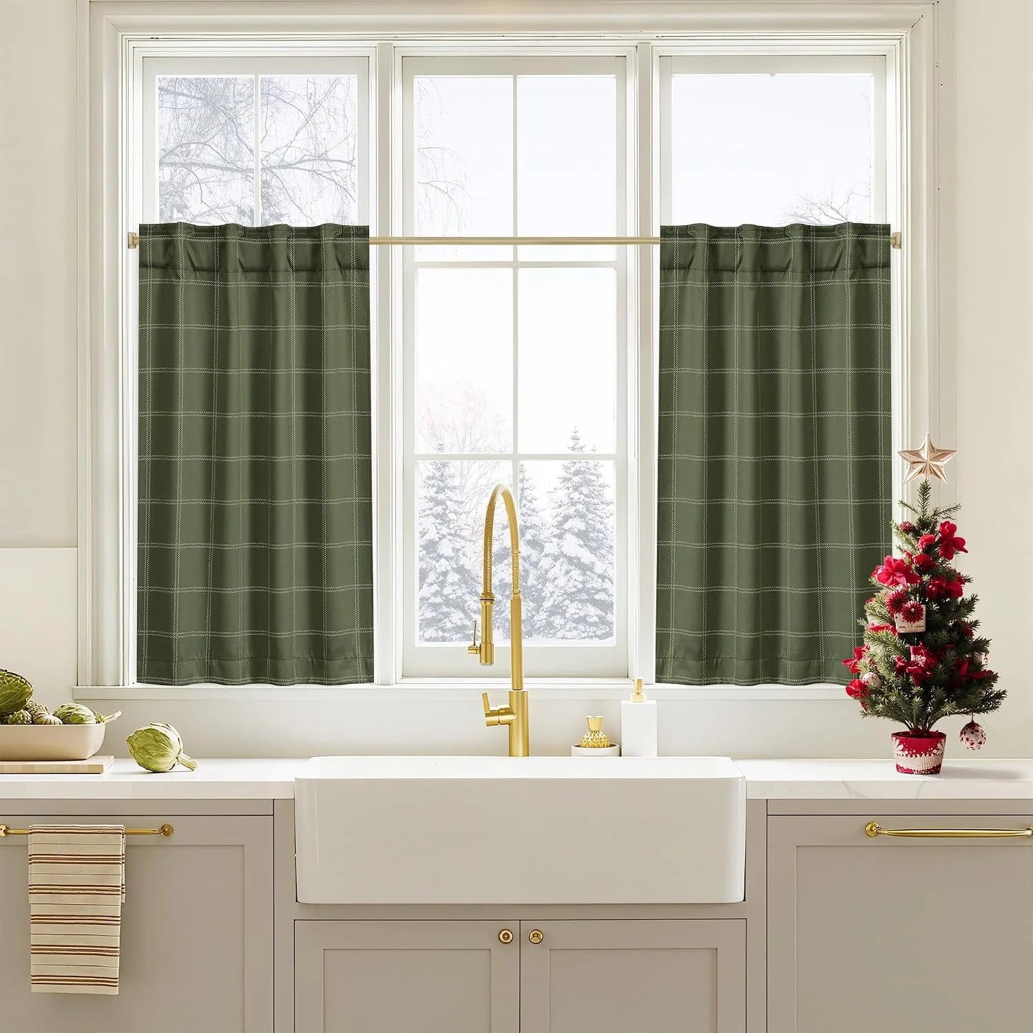 Olive green plaid cafe curtains on a white kitchen window above farmhouse sink