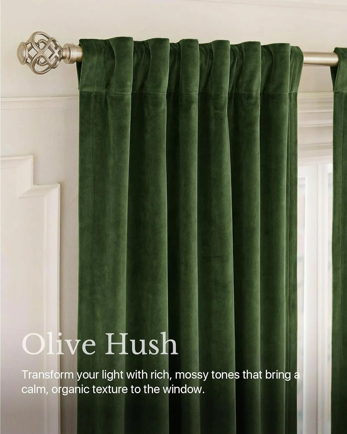 Olive green velvet curtains with rod pocket pleats on a brushed metal curtain rod