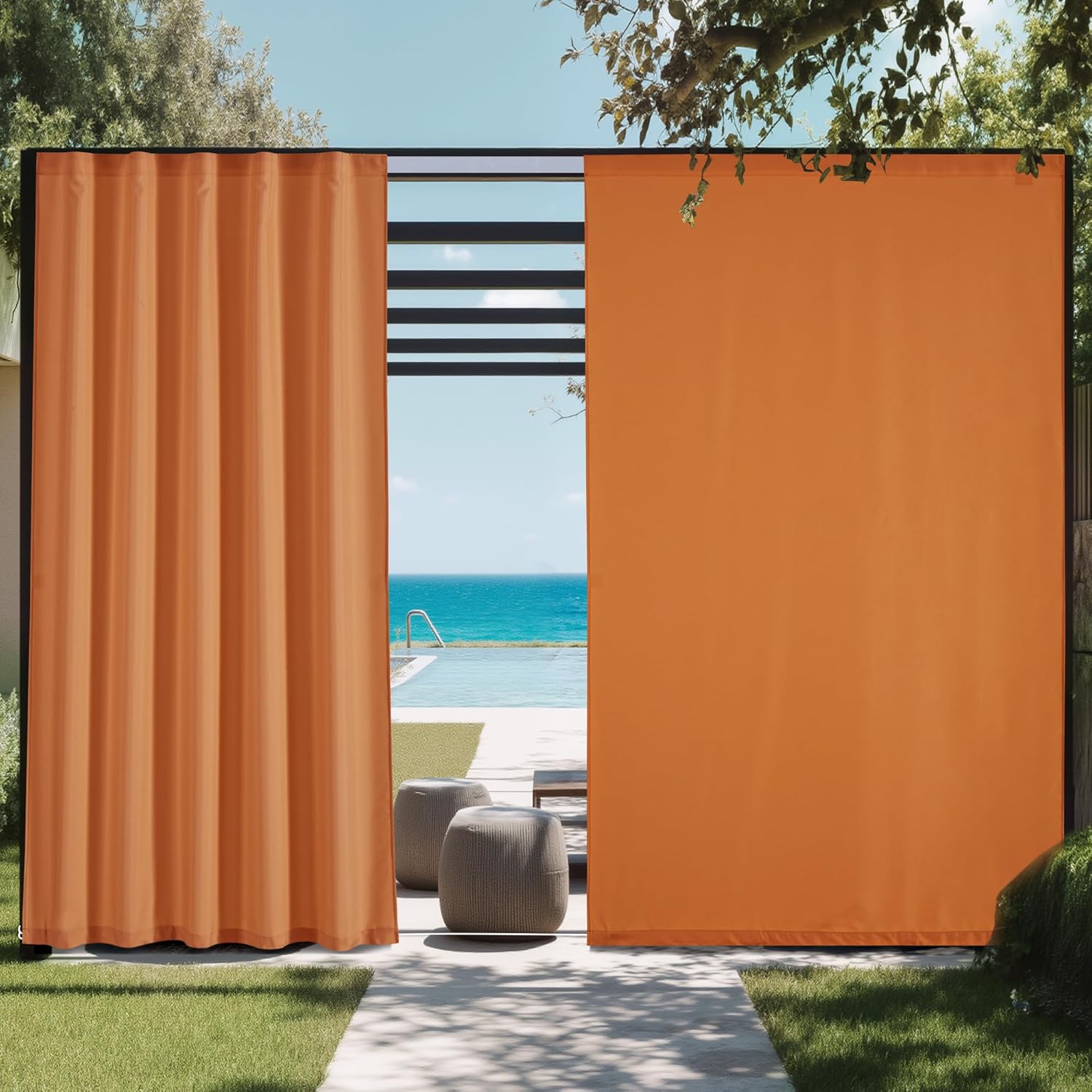 Vibrant orange retractable outdoor patio curtains by a pool with an ocean view.