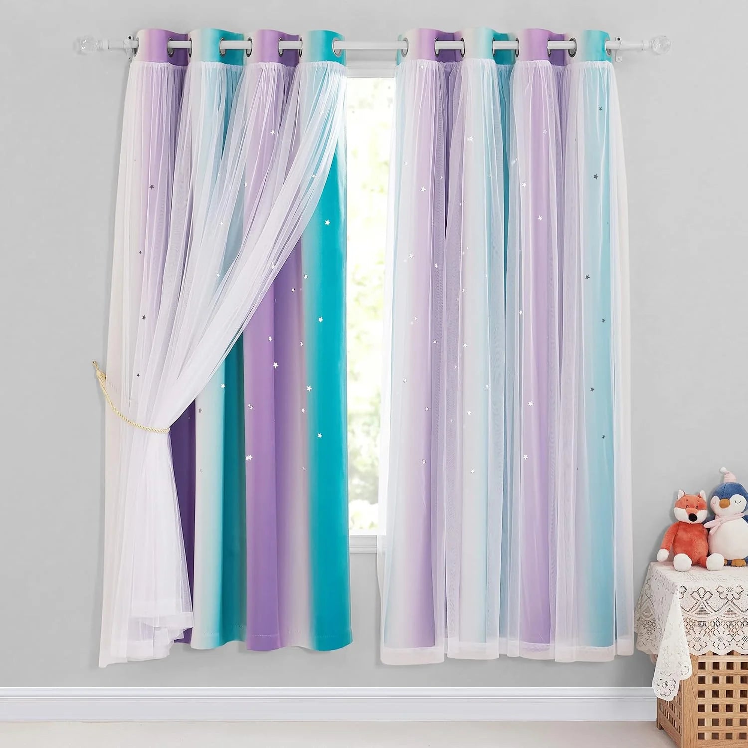 Pastel ombre kids curtains with white sheer overlay and star details on a window