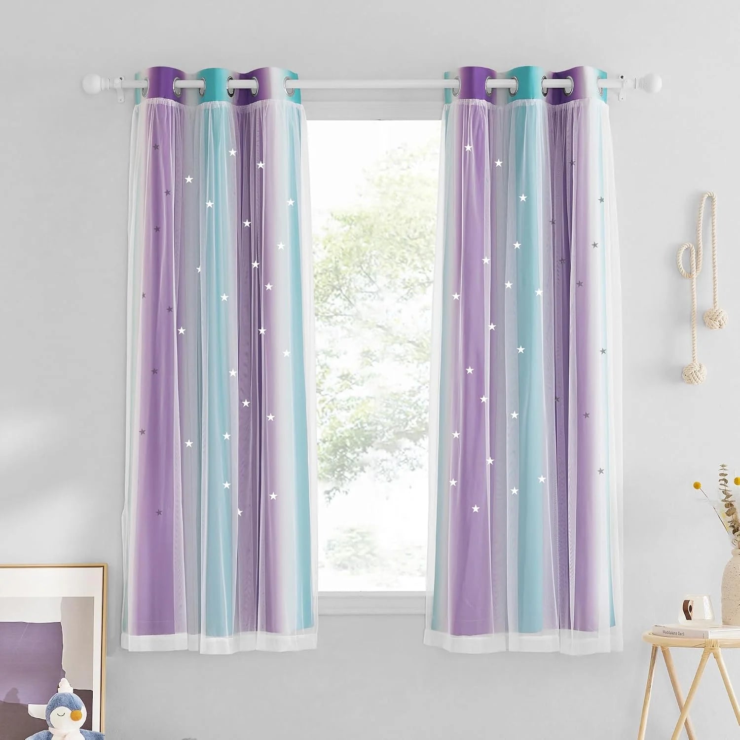 Pastel ombre sheer curtains with star details on a white grommet rod