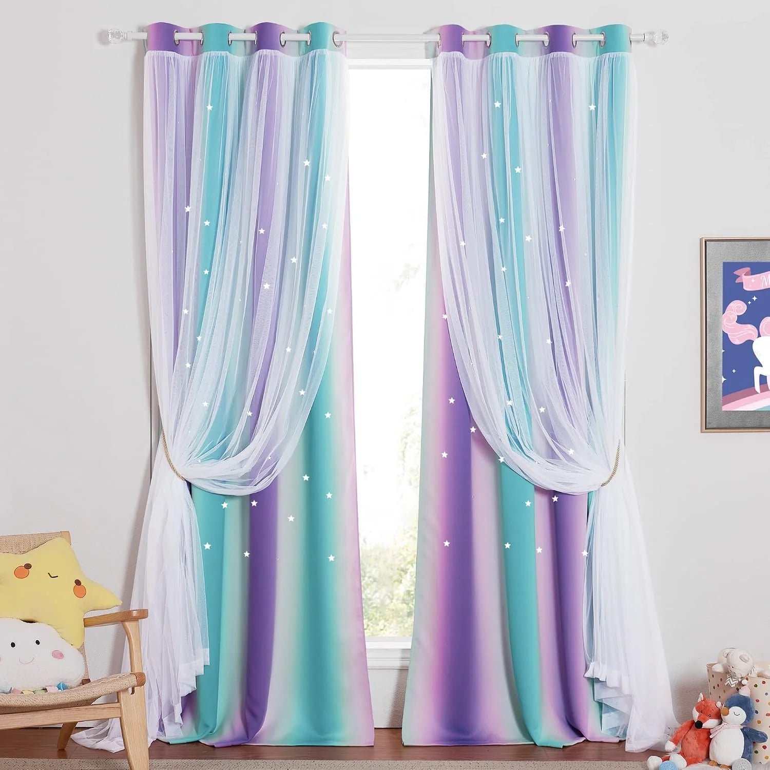 Pastel ombre curtains with white tulle overlay and star lights in a kids bedroom